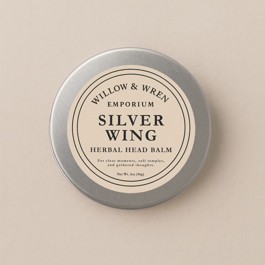 Tin of Willow & Wren Emporium Silver Wing Herbal Head Balm on a beige background